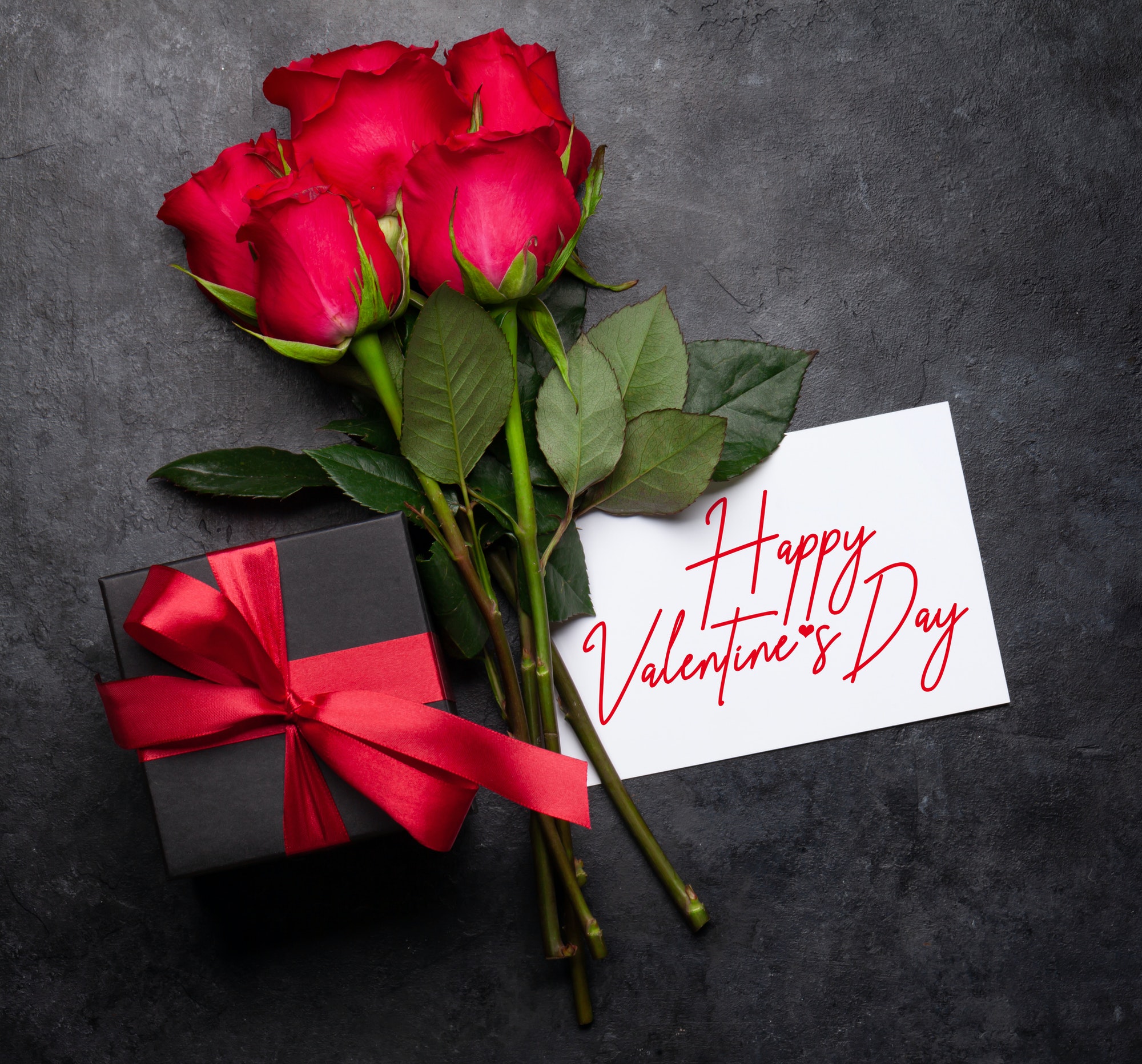 Valentines day greeting card with rose flowers and gift box